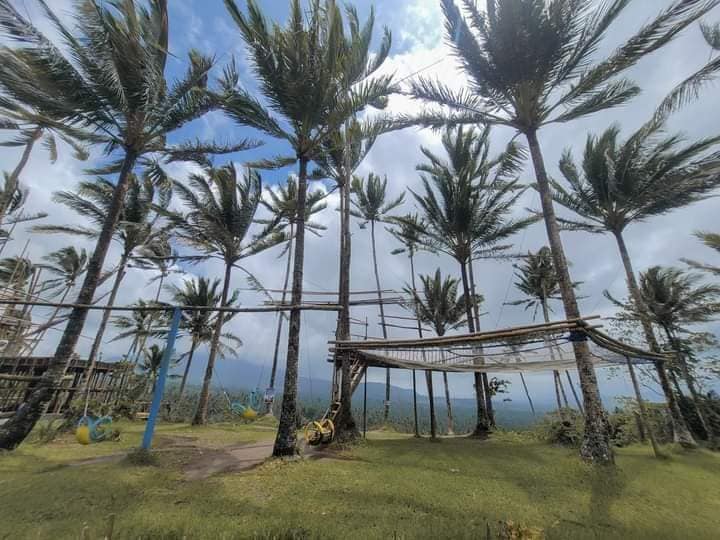 Visitors resting on net lounge at Esmeris Farm